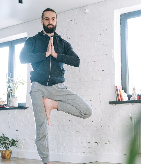 Focused man meditating after a workout, feeling energized.