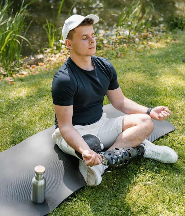 Man performing a strength and balance exercise in a calm environment.